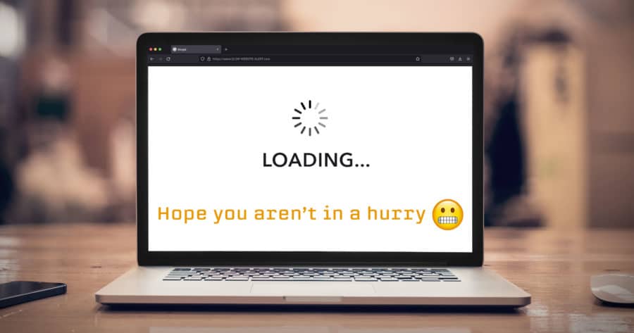 A laptop with the text loading hope you're not in a hurry.